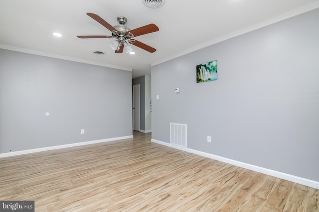 unfurnished room with crown molding, ceiling fan, and light wood-type flooring