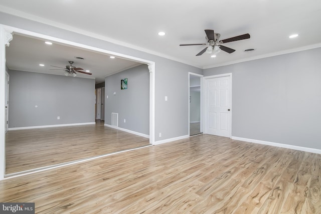 empty room with crown molding, ceiling fan, and light wood-type flooring