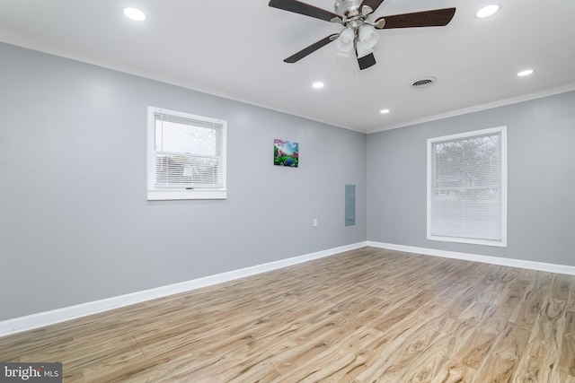 unfurnished room featuring light wood-type flooring, ceiling fan, and ornamental molding