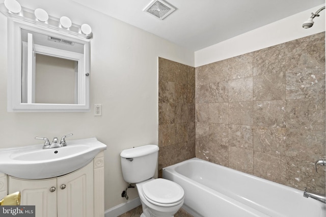 full bathroom with vanity, toilet, and tiled shower / bath