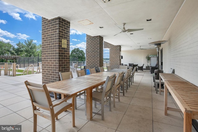 view of patio featuring ceiling fan