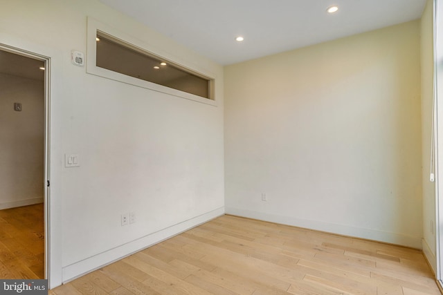 spare room featuring light hardwood / wood-style flooring