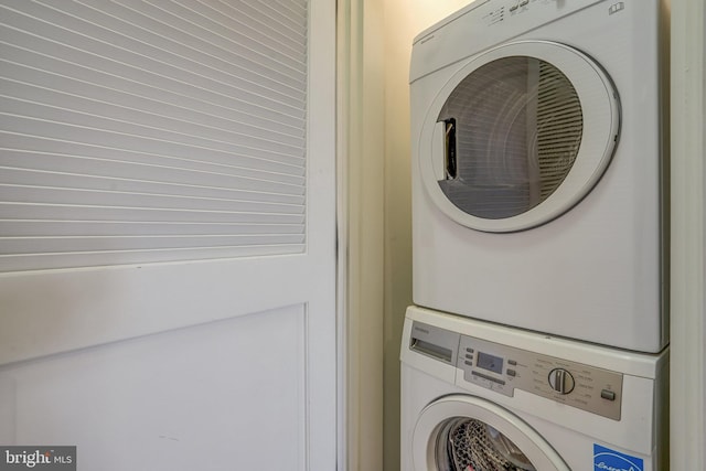 washroom with stacked washer and clothes dryer