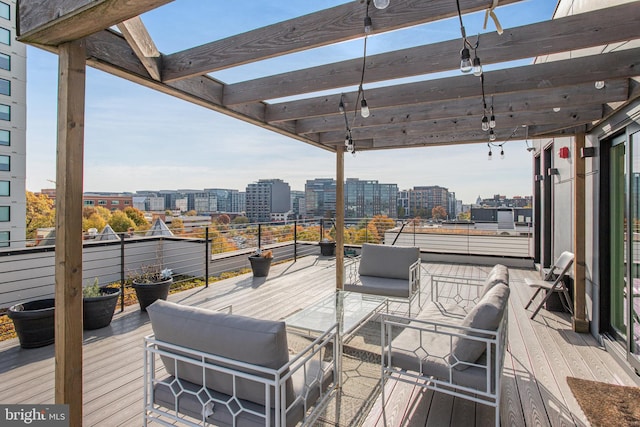 deck featuring outdoor lounge area and a pergola