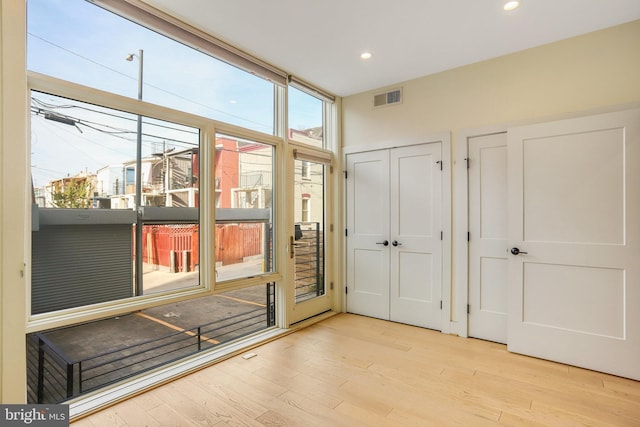 doorway to outside featuring light hardwood / wood-style flooring