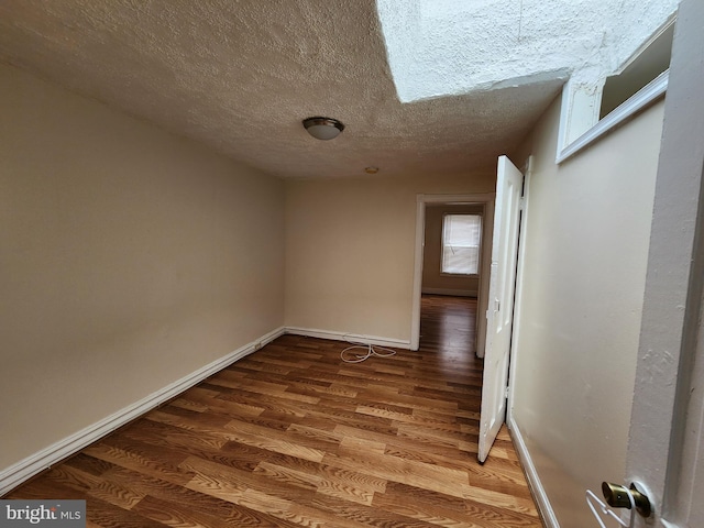 502 Brunswick St, Baltimore, MD 21223 - unfurnished room featuring wood finished floors, a textured ceiling, and baseboards