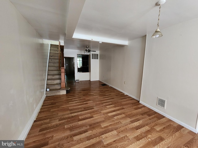 502 Brunswick St, Baltimore, MD 21223 - unfurnished living room with wood finished floors, stairs, and baseboards