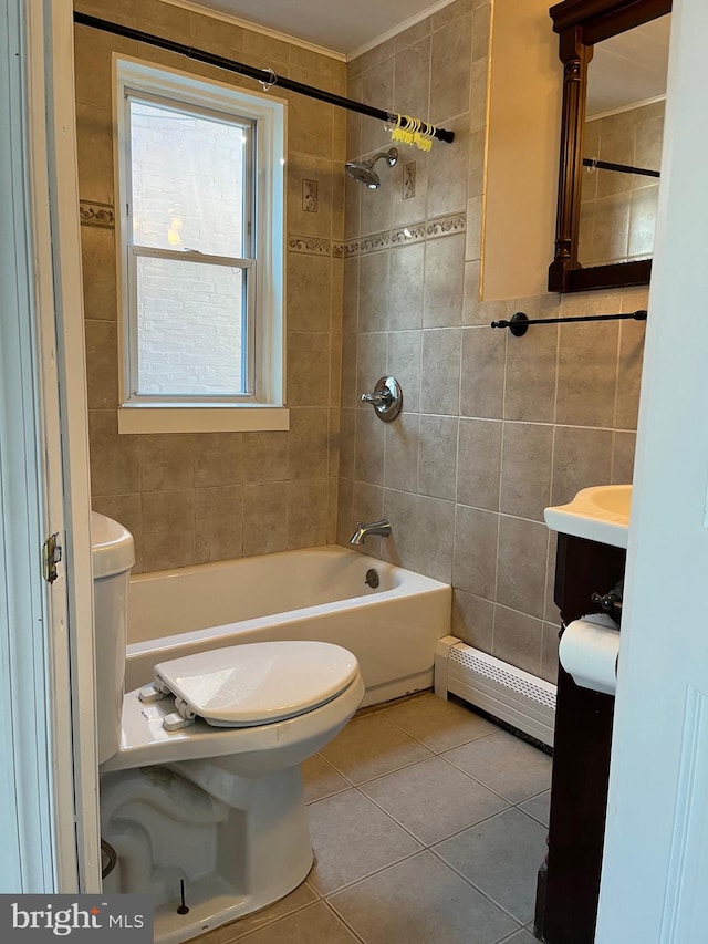 full bathroom with tile patterned floors, a baseboard heating unit, tile walls, toilet, and tiled shower / bath