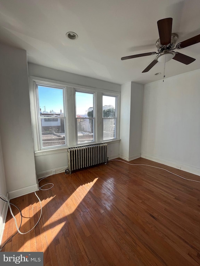3358 Livingston St, Philadelphia, PA 19134 - spare room with radiator, wood finished floors, baseboards, ceiling fan, and recessed lighting