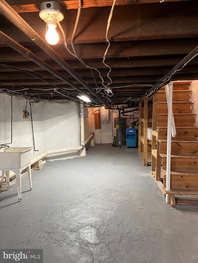 3358 Livingston St, Philadelphia, PA 19134 - unfinished basement featuring water heater, stairway, and a sink