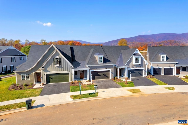 view of front facade featuring a mountain view and a garage