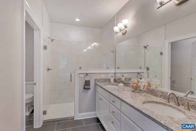 bathroom featuring tile patterned flooring, vanity, toilet, and walk in shower