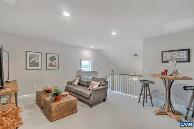 carpeted living room with lofted ceiling and a notable chandelier