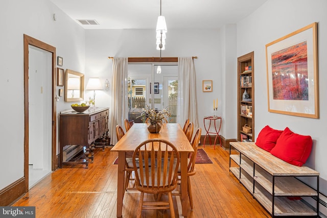 dining space featuring light wood-type flooring