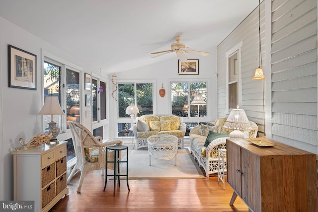 sunroom / solarium with ceiling fan, lofted ceiling, and a wealth of natural light