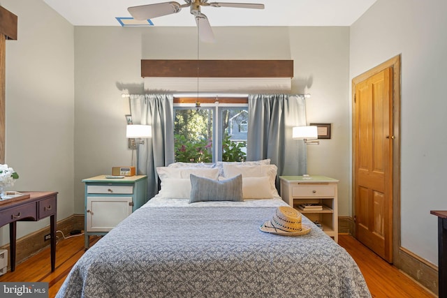 bedroom with ceiling fan and light hardwood / wood-style floors