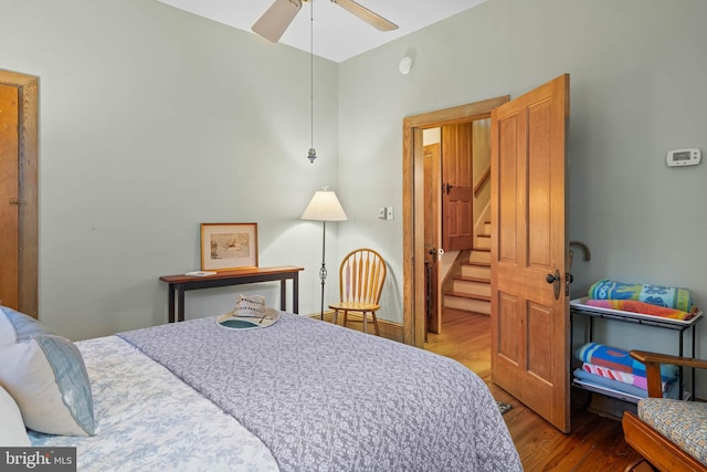 bedroom featuring hardwood / wood-style floors and ceiling fan