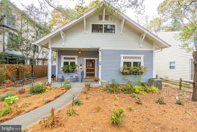 view of front of property with central AC unit and a patio area