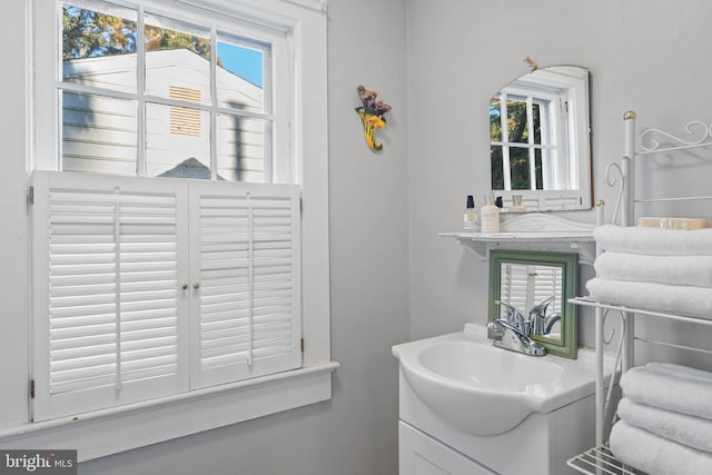 bathroom with vanity and a healthy amount of sunlight