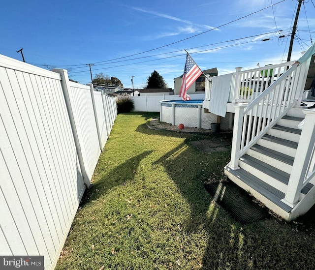 view of yard featuring a pool side deck