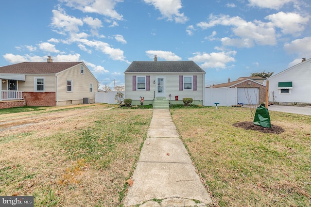 bungalow-style home with a front lawn