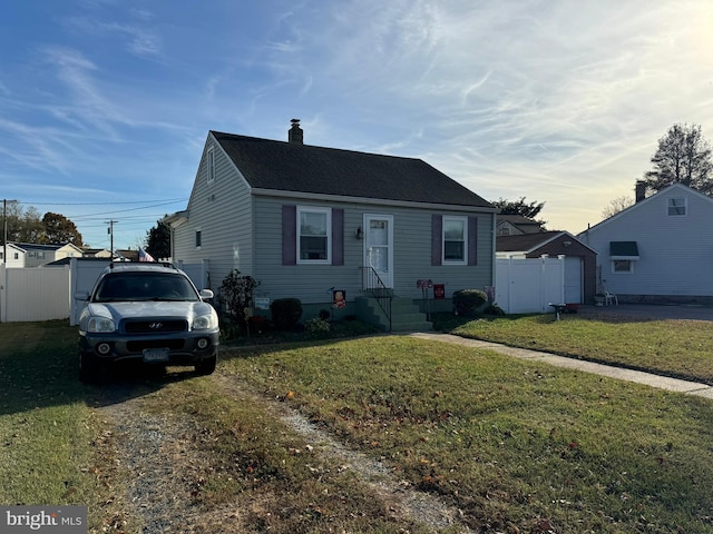 bungalow featuring a yard