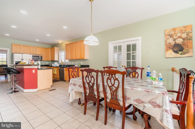 tiled dining space with french doors