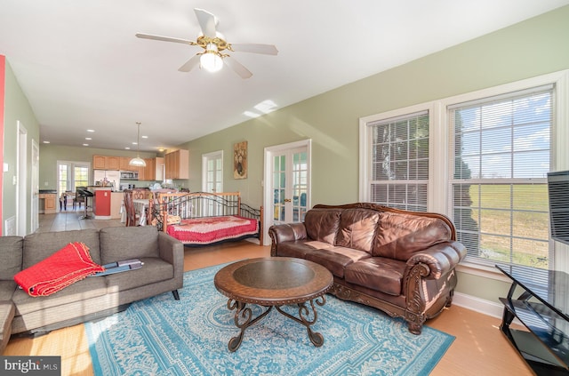 living room with french doors and ceiling fan