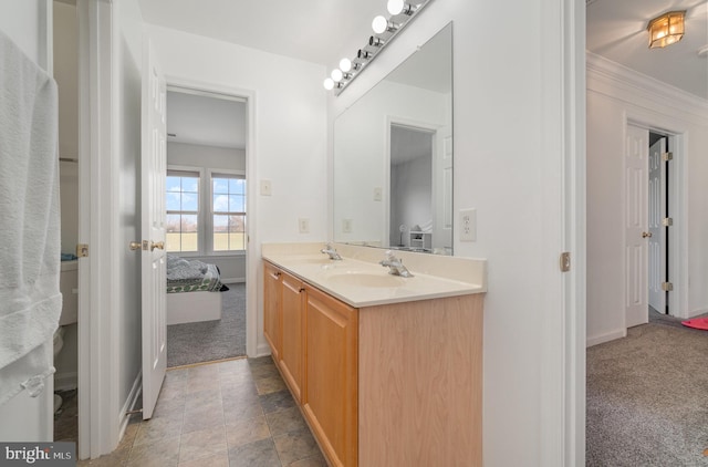 bathroom with vanity and ornamental molding