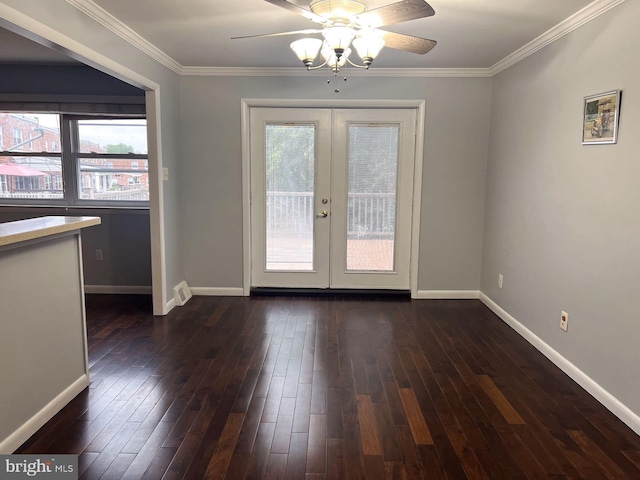 doorway with dark hardwood / wood-style floors, plenty of natural light, and french doors