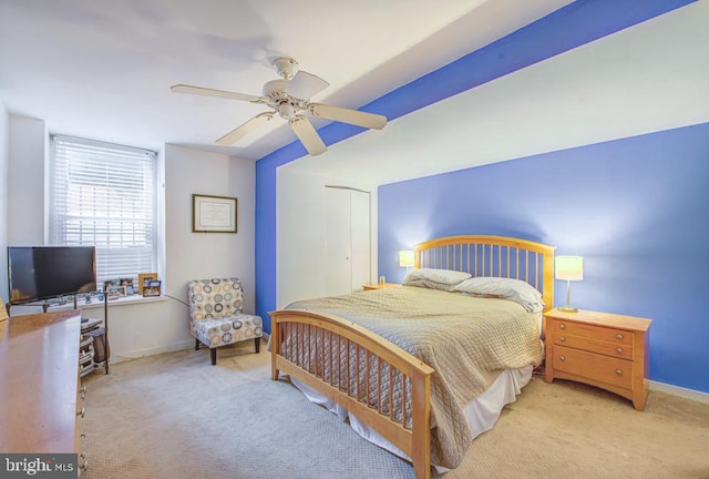 bedroom with light colored carpet and ceiling fan