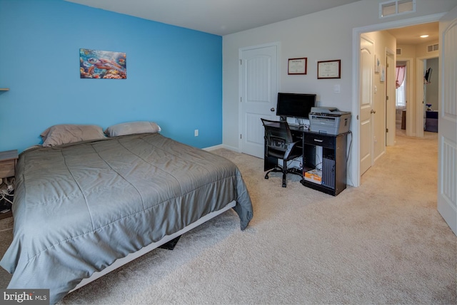 bedroom with light colored carpet