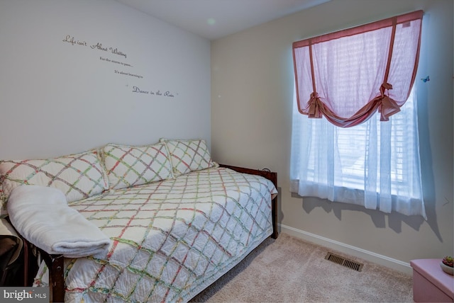 bedroom featuring carpet