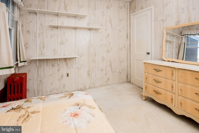 bathroom featuring concrete floors and radiator