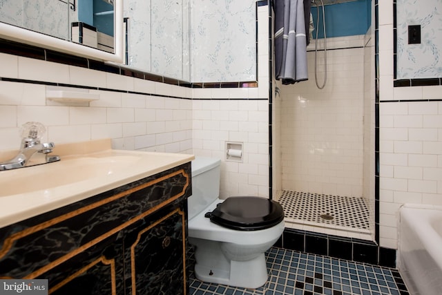 2217 N 59th St, Philadelphia, PA 19131 - bathroom with tile walls, wallpapered walls, a shower stall, toilet, and tile patterned flooring