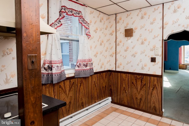 2217 N 59th St, Philadelphia, PA 19131 - detailed view of a baseboard heating unit, wallpapered walls, and wainscoting