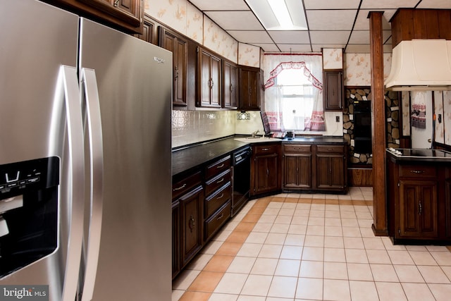 kitchen featuring dark brown cabinets, stainless steel fridge with ice dispenser, a paneled ceiling, and black dishwasher