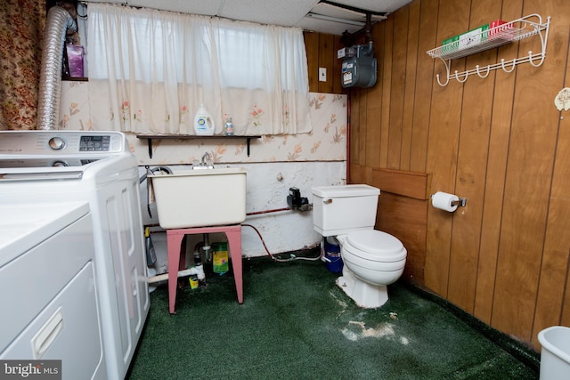 2217 N 59th St, Philadelphia, PA 19131 - bathroom featuring washer / clothes dryer, a sink, toilet, carpet, and wooden walls