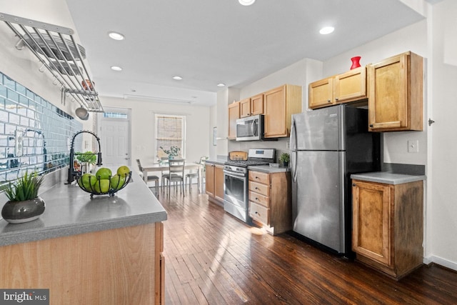 kitchen featuring light brown cabinets, appliances with stainless steel finishes, sink, and dark hardwood / wood-style floors