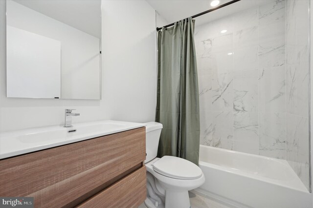 full bathroom featuring vanity, toilet, and shower / bathtub combination with curtain