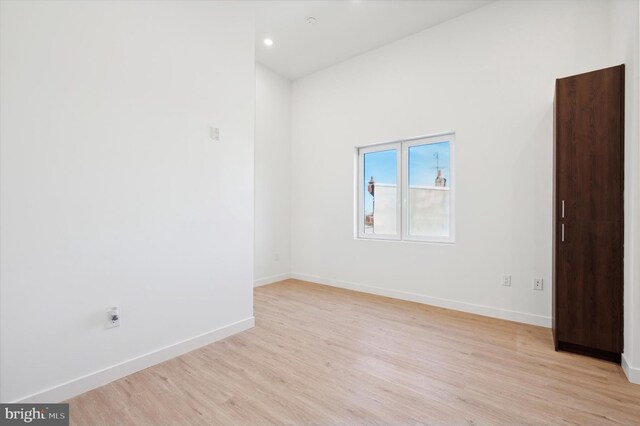 spare room featuring light hardwood / wood-style floors