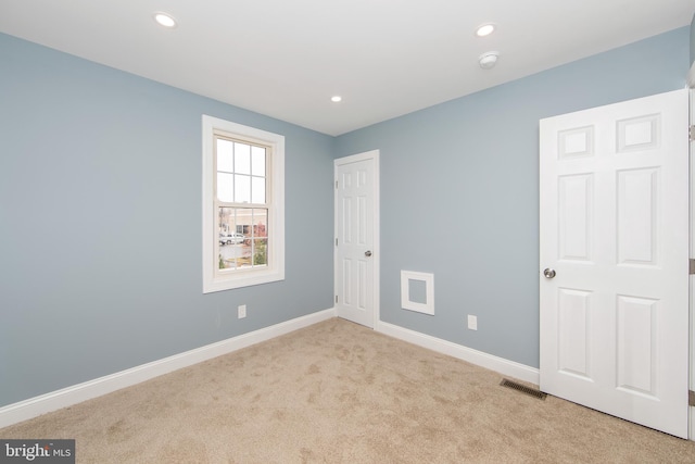 view of carpeted spare room