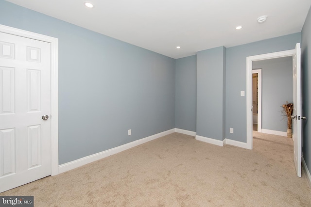 unfurnished bedroom with light carpet