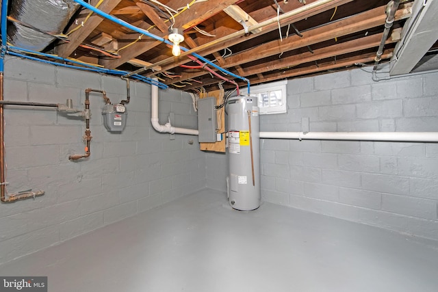 basement featuring electric panel and water heater