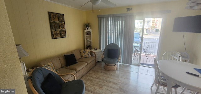 3 63rd St Unit 14, Ocean City, MD 21842 - living room with wood finished floors, ornamental molding, ceiling fan, and wooden walls