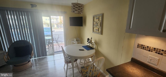 dining space featuring light wood-type flooring