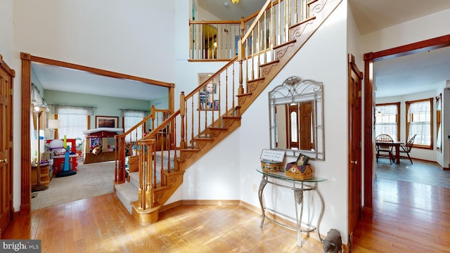 stairway featuring hardwood / wood-style floors