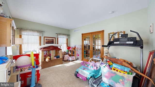 playroom featuring carpet floors and french doors