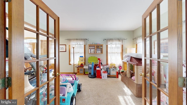 rec room featuring carpet and french doors