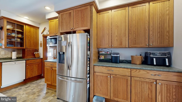 kitchen featuring decorative backsplash and appliances with stainless steel finishes